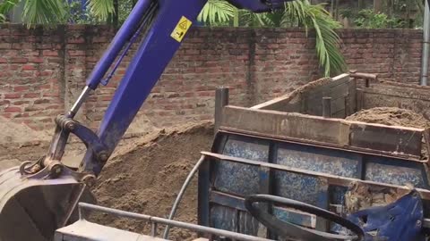 Kid Driving an Excavator