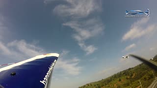 Stunt pilot's wing comes within inches of ground!