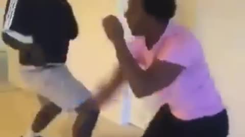 Two black guys one adidas jacket one ping shirt fighting in living room