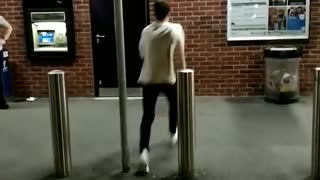 Guy in white shirt back flip off brick wall