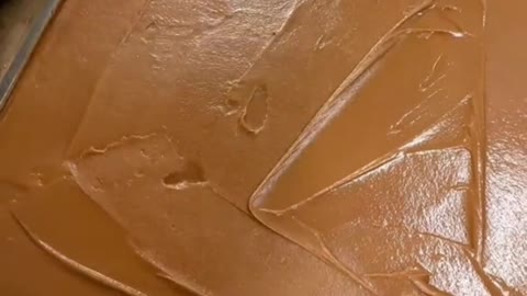 leveling out a slab of caramel