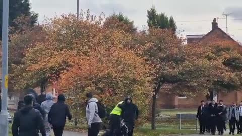 A group of around 15 thugs, one armed with a machete attack one person outside a school in Walsall.