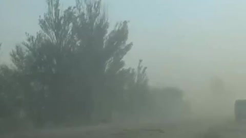 To get to Mariupol, drivers have to break through the dense smog