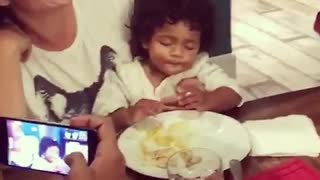 Baby can't decide between sleeping or eating, does both