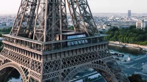 The Eiffel Tower, at 330 meters, by the Seine, was the tallest in the world at the time,
