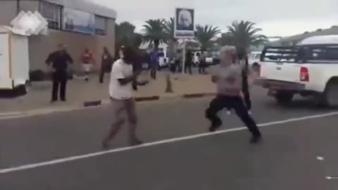 Man fights two at once