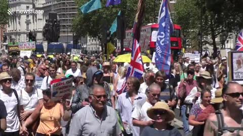 Protester outside Downing Street falsely expresses dangers of vaccine