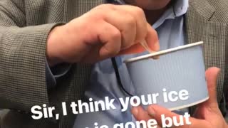 Man in suit eating ice cream