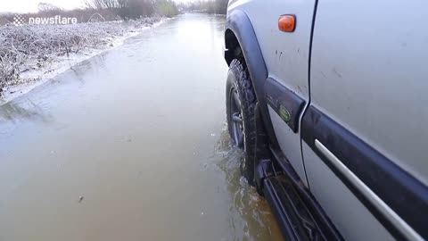 Land Rover smashes through ice during Storm Christoph floods in Yorkshire