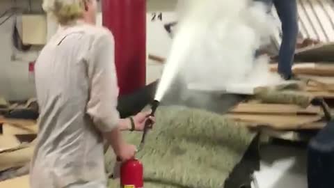 Pile of rugs guy fire extinguishered