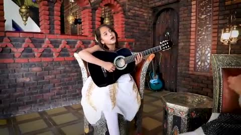 Cute girl singing despacito guitar