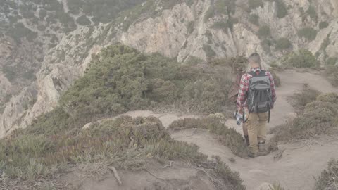 Backpackers Going Down the Mountain