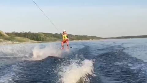 Guy slow mo red shorts wake board fail