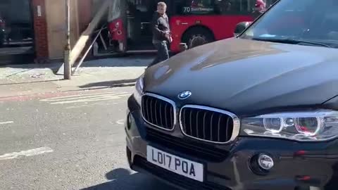 London bus curses into a shop