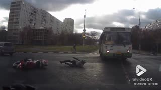 Biker loses control at junction