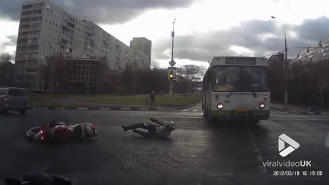 Biker loses control at junction