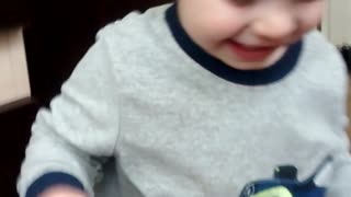 adorable toddler laughing at mommy's reaction