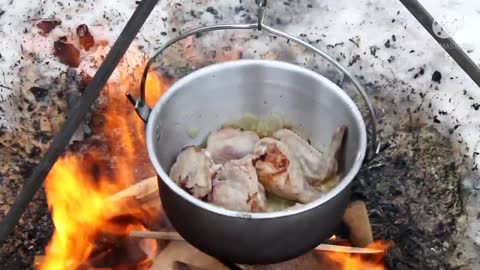 Siberian hunters cooking soup