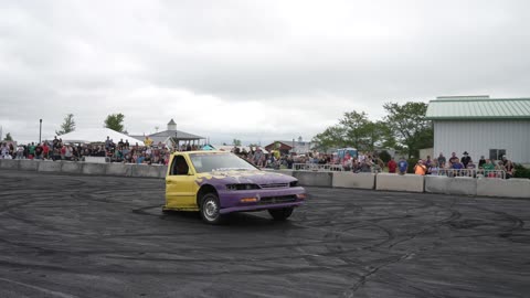 Front half of a car doing burnouts.