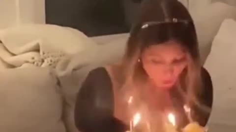 chick blowing out candles sets her hair on fire