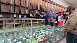 Buying a new gun from the store.