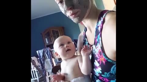 Mom Decides To Leave Her Mask On, But Her Baby Doesn't Seem To Be A Fan