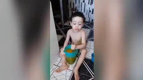 little child making fruit juice, orange juice, very beautiful.