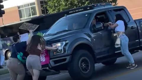Pro-Abortion Protesters swarm and attack truck in Cedar Rapids IA
