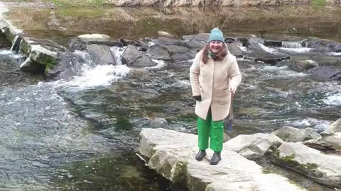 Phone Falls Into River When Woman Jumps For Picture