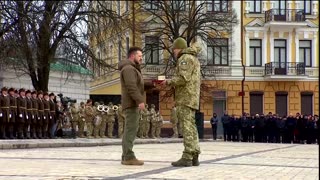 Ukraine grieves, vows to fight amid war anniversary