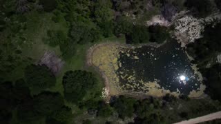 Solar Eclipse 2024 April reflected in pond from Drone