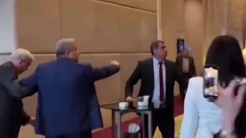 A Ukrainian delegate punched a Russian delegate after he grabbed the #Ukraine flag at a summit