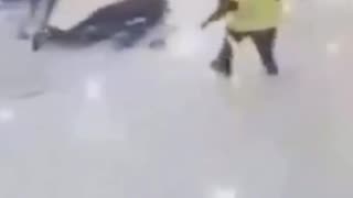 Coward holds a knife in a store. Coward gets tackled.