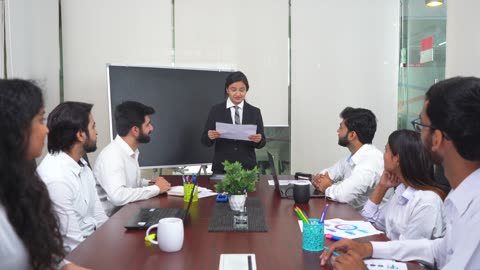 Businesswoman Praising Coworkers for All Their Hard Work