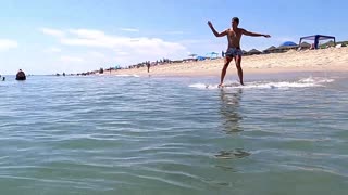 Skim boarding fun on a gorgeous July summer day in Nags Head, NC