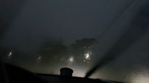 Lightning Strikes Near Moving Car