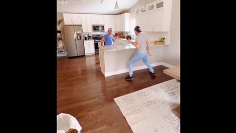 Two people play table tennis