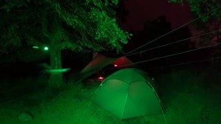 Campfire under a tarp nightlapse.