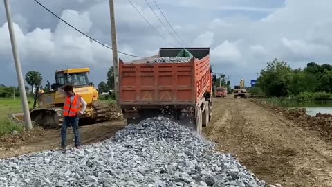 New bulldozer spreading gravel processing features building road foundation-5