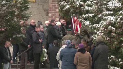 Polish villagers bury man killed in blast near Ukrainian border