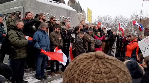 After dismantling barriers around the War Memorial Veterans say the Lord's Prayer and sing O Canada