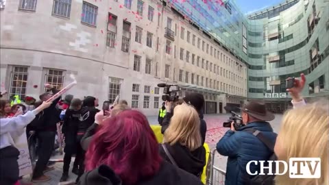 Red roses being thrown at BBC, to commemorate the vaccine injured and bereaved