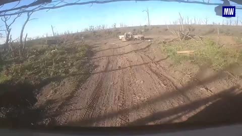 Russian military personnel evacuating residents of Ocheretino