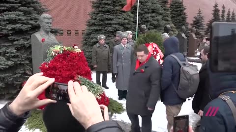 In Russia, as they gather to honour Stalin; a man is arrested.