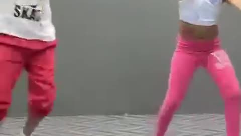 Funny boy and girl dancing