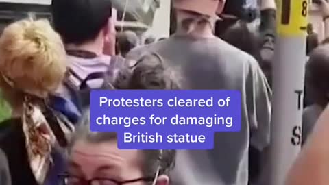 A British court cleared 4 protesters of charges for damaging a statue of a slave