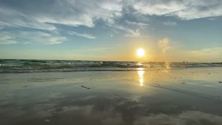 Satisfying sunset waves crashing on the beach