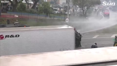 Brazilian police fire water cannons and rubber bullets at anti Lula protesters
