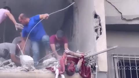 Horrifying scenes of a civilian being rescued from under the rubble in northern Gaza
