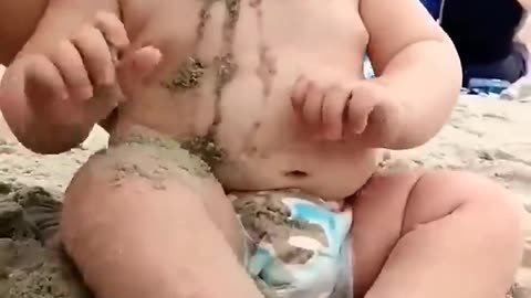 Funny babies reaction on the beach